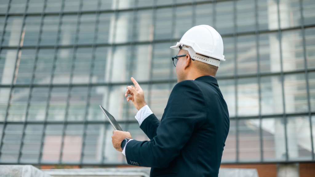 Real Estate Asset Manager in front of a building