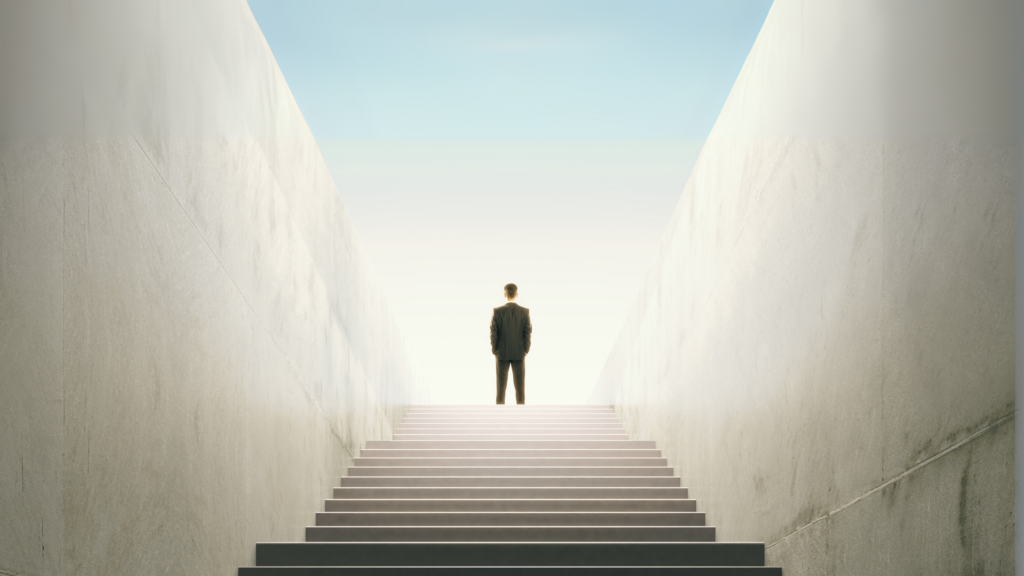 A person in a suit stands at the top of a long staircase, symbolizing a structured hiring or career process.