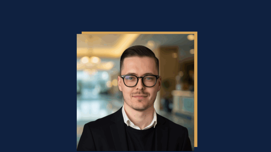 Portrait of Victor Mogilev, Partner & Managing Director Asia Pacific at LHC International, in front of a softly blurred hotel lobby background